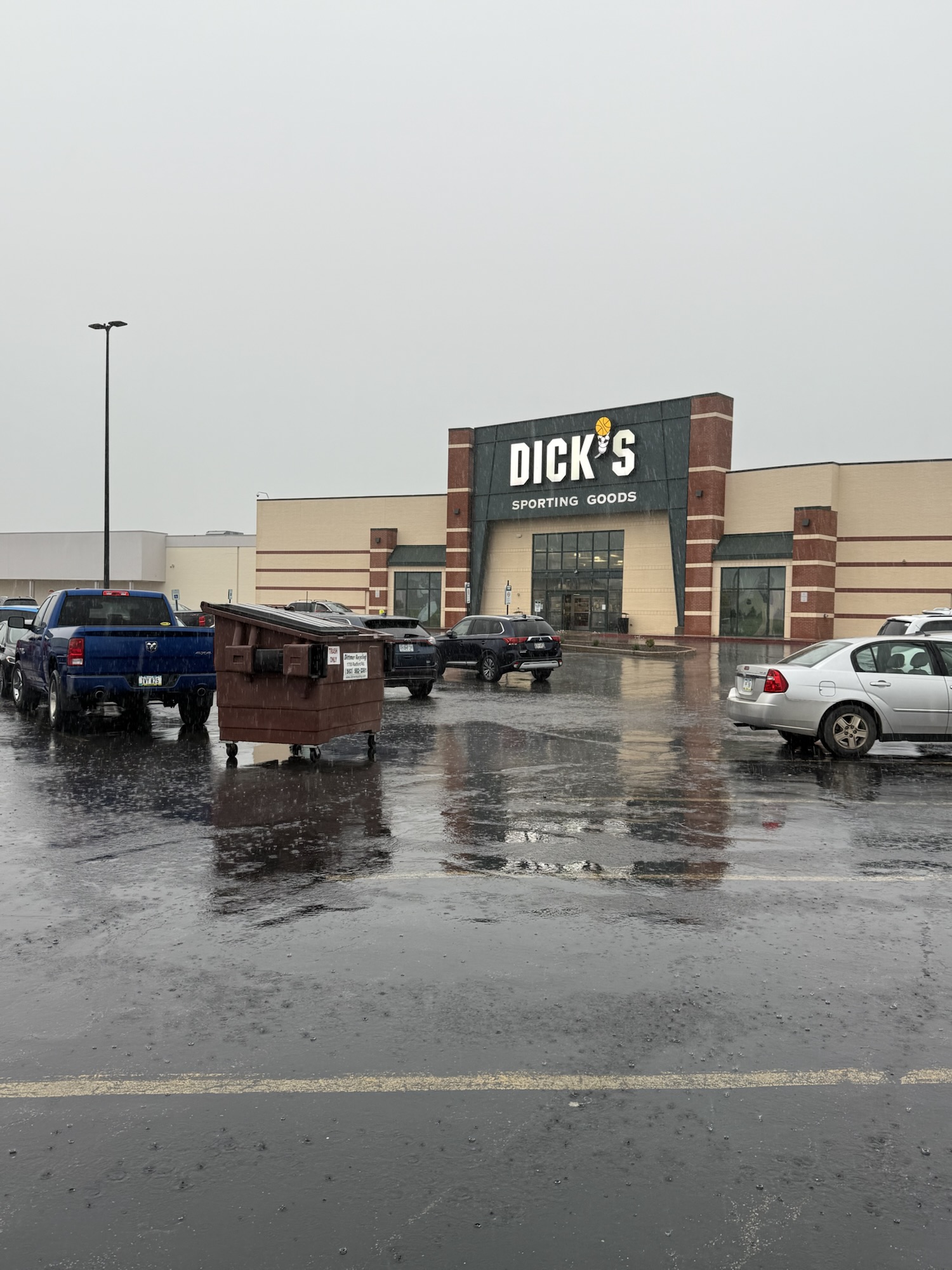 A dumpster collided with multiple cars in the parking lot of Kennedy Mall in Dubuque.